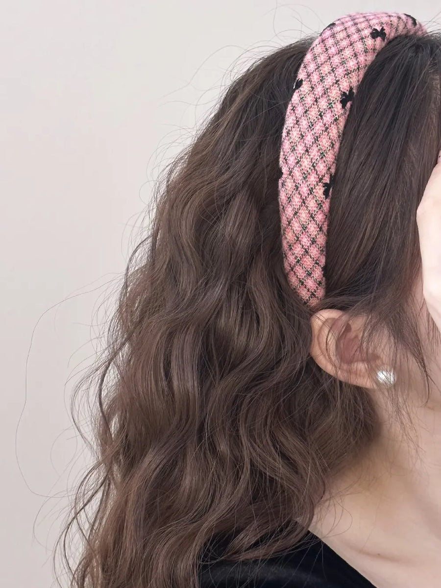 Pink tweed headband with black bow pattern detail
