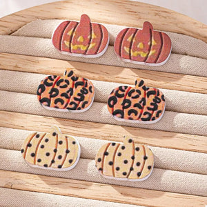 black earrings featuring stud earrings and polka dot, graphic print, leopard-print