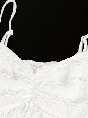 White sweetheart neck cami top with textured fabric and ruffled details.