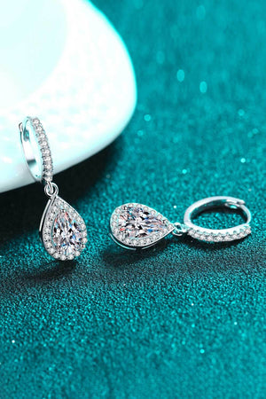 Silver teardrop halo hoop earrings with pavé accents and a large center stone.