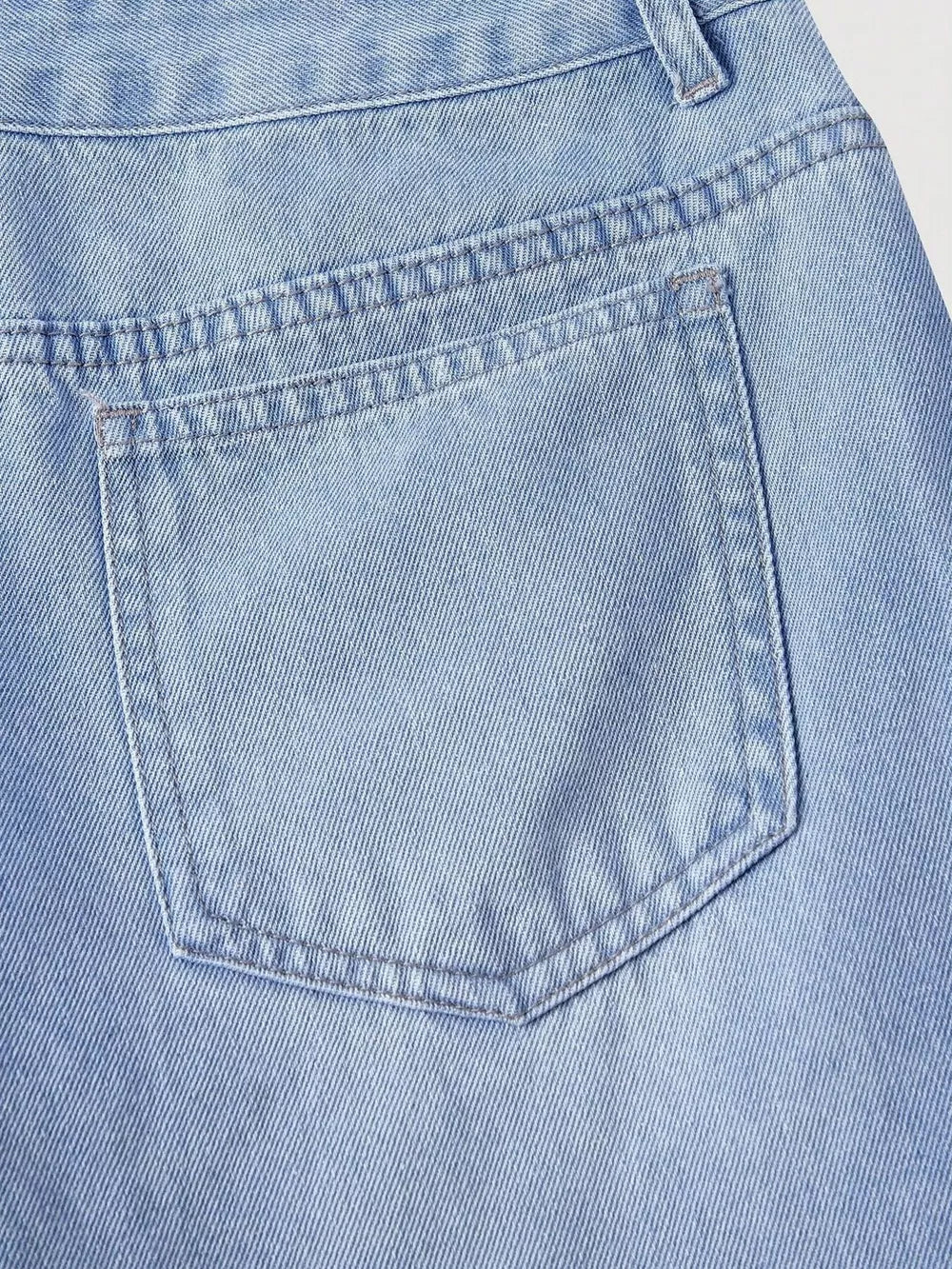 95% polyester, 5% elastane Care instructions: Machine wash cold wide-leg jeans in light blue with flared silhouette