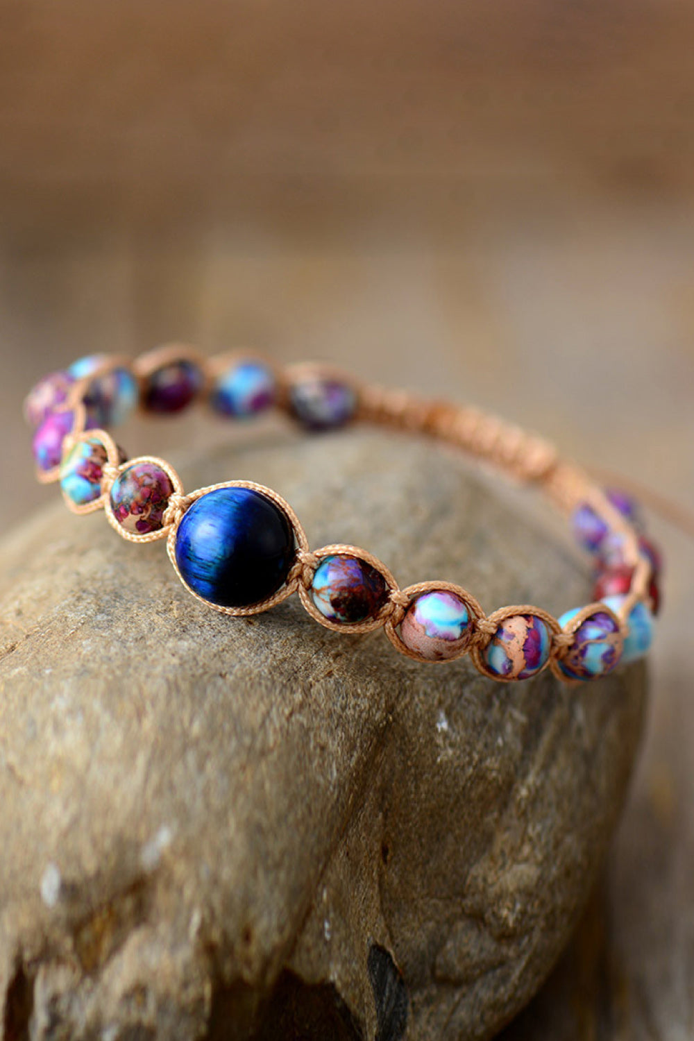 Bohemian jasper beadwork bracelet with multicolor beads and a central blue stone.