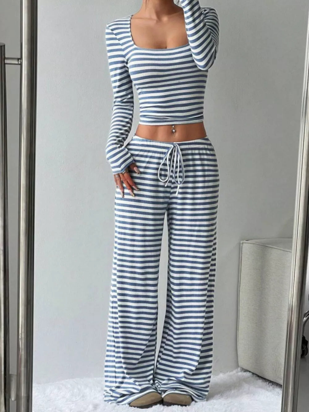 Sky blue and white striped crop top and wide-leg pants with drawstring waist.