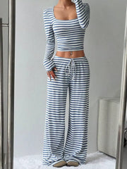 Sky blue and white striped crop top and wide-leg pants with drawstring waist.