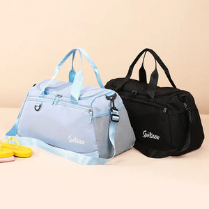 Nylon duffle bag in pastel blue and black with mesh pockets and adjustable straps.