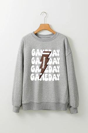 Gray sweatshirt with repeating "Gameday" text and a football lightning bolt graphic.