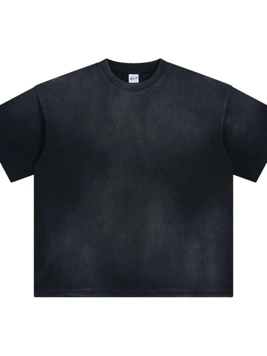 Oversized washed black t-shirt with relaxed fit and crew neck.