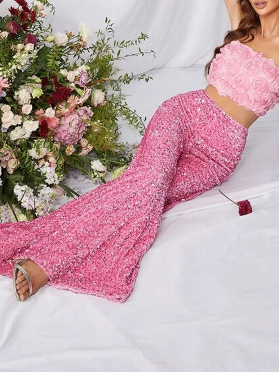 Pink sequin wide leg pants with a flowy fit, styled with a matching crop top.