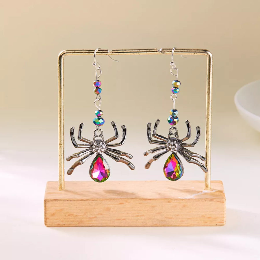 earrings featuring spider motif in Heliotrope Purple with Alloy,Crystal,Silver-plated Care instructions: Avoid wearing
