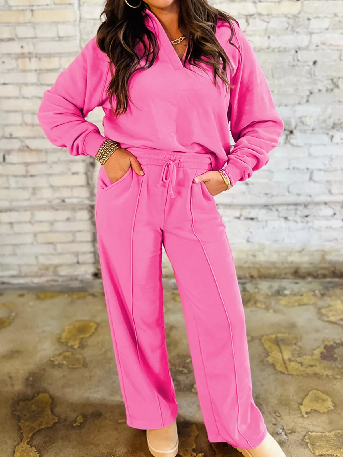 Hot pink collared pullover and wide-leg pants set with drawstring waist and seam detail.
