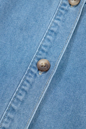 Denim button-down dress with visible button detail and stitching