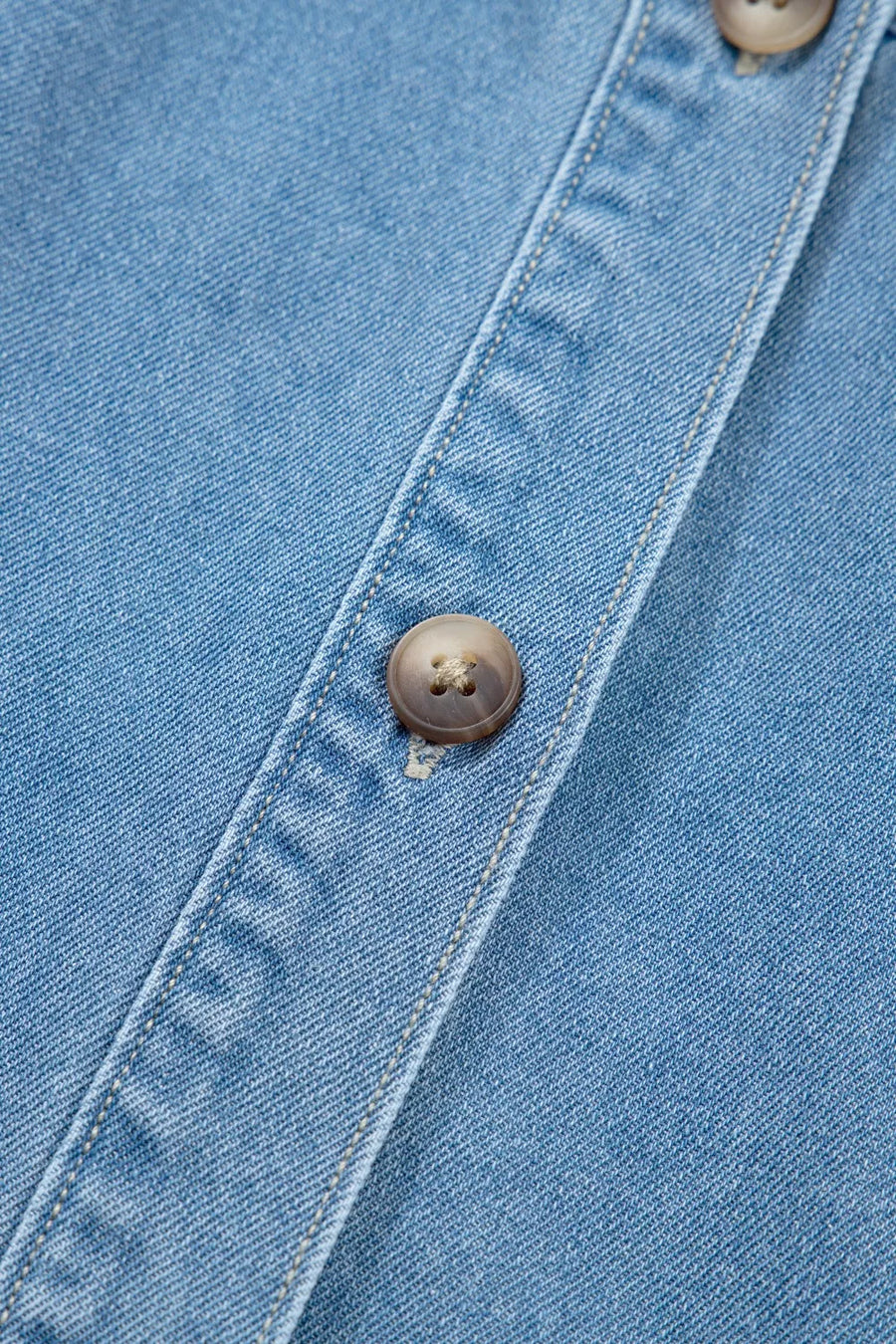 Denim button-down dress with visible button detail and stitching