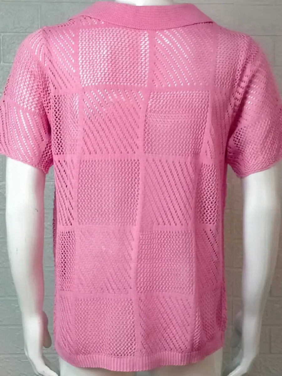 Pink geometric knit polo shirt with open weave pattern and short sleeves.
