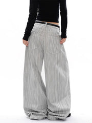 Men's grey pinstripe wide-leg sweatpants with a relaxed fit and elastic waistband.