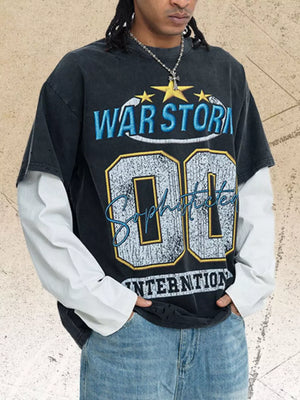 Men's black graphic t-shirt with distressed details and white long sleeves.