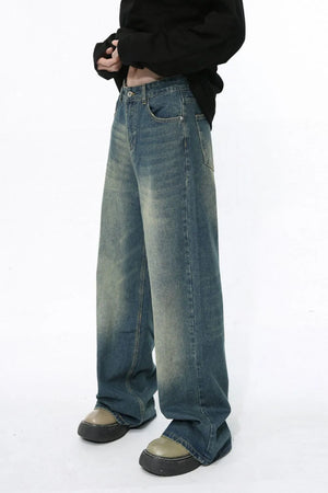 Faded wash wide-leg jeans in medium blue denim with a relaxed fit.