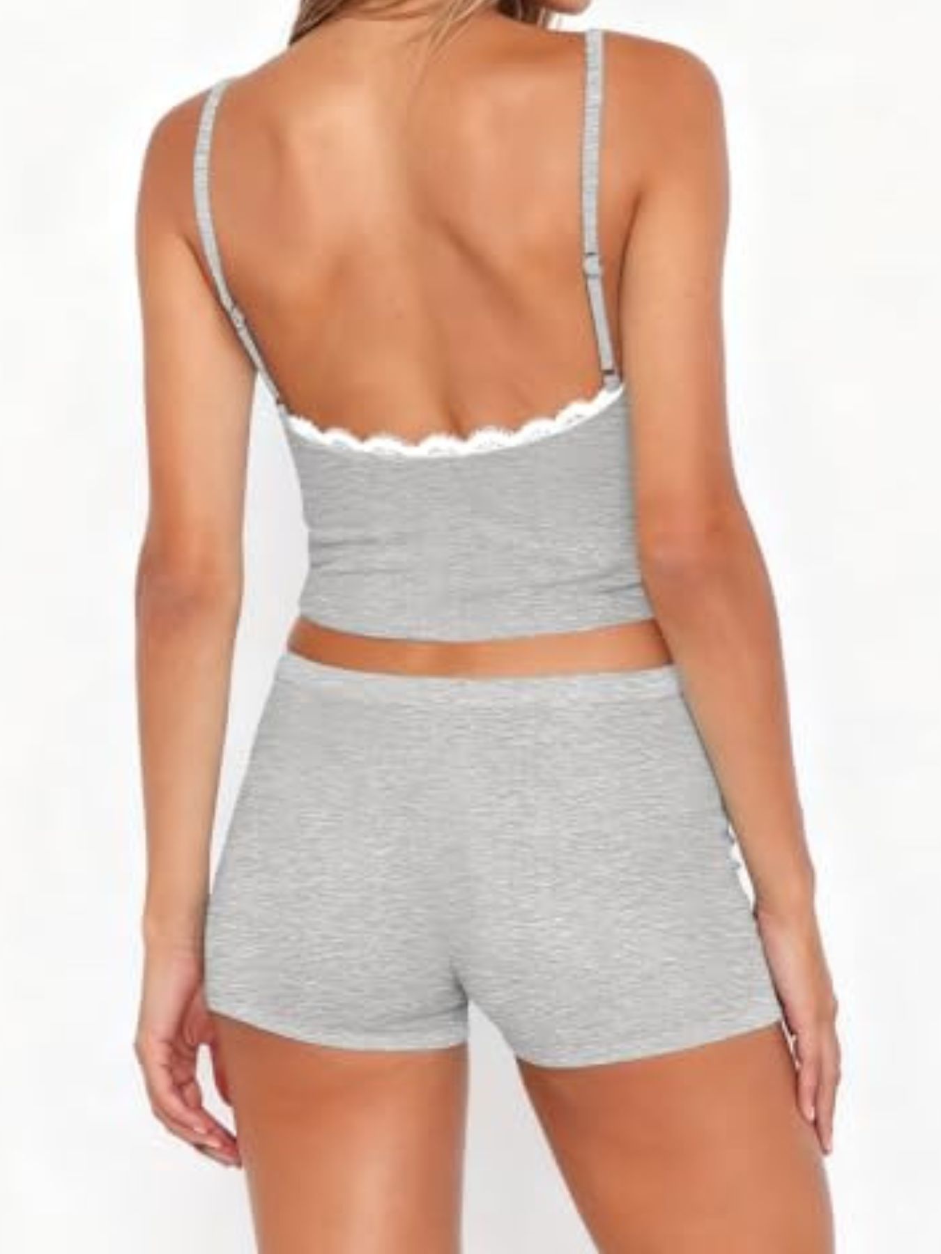 Light gray lace-trimmed cami and shorts pajama set with adjustable straps.