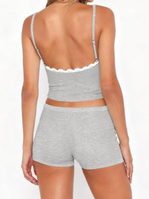 Light gray lace-trimmed cami and shorts pajama set with adjustable straps.