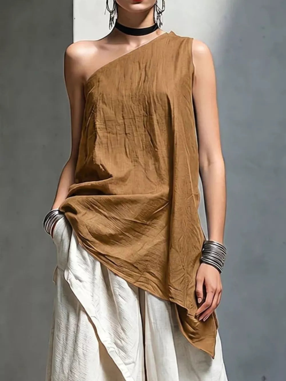 100% polyester Care instructions: Machine wash cold one-shoulder top in Light Blue with relaxed silhouette