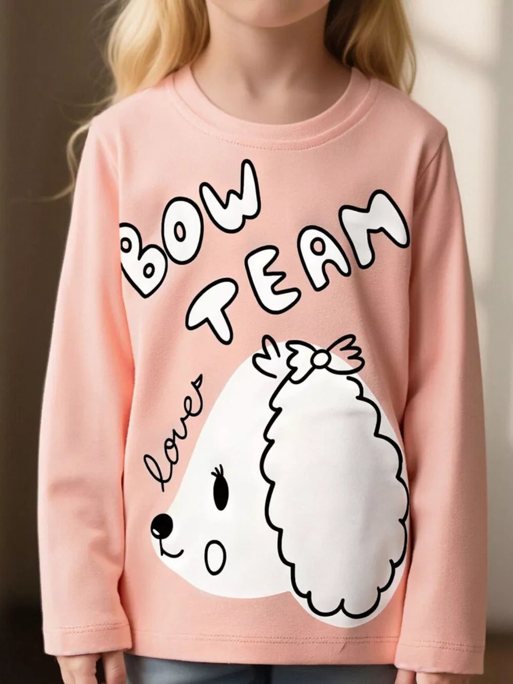 Pink long sleeve cotton t-shirt with crew neck and a cute dog graphic that says Bow Team lover.