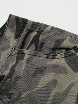 Camouflage cargo capris in cotton with utility pockets and button fly detail.