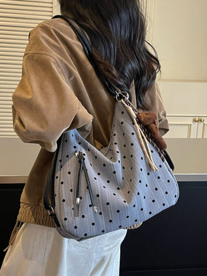 shoulder bag in black with polka dot and exterior zip pocket