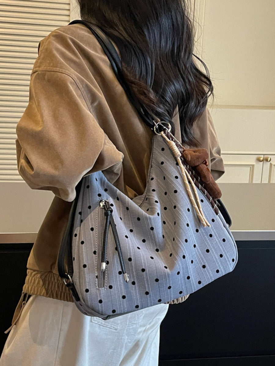 shoulder bag in black with polka dot and exterior zip pocket