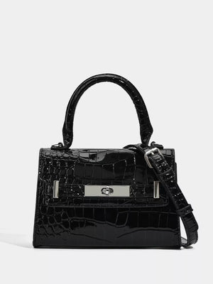 Black croc-embossed small tote bag with silver hardware and adjustable strap.