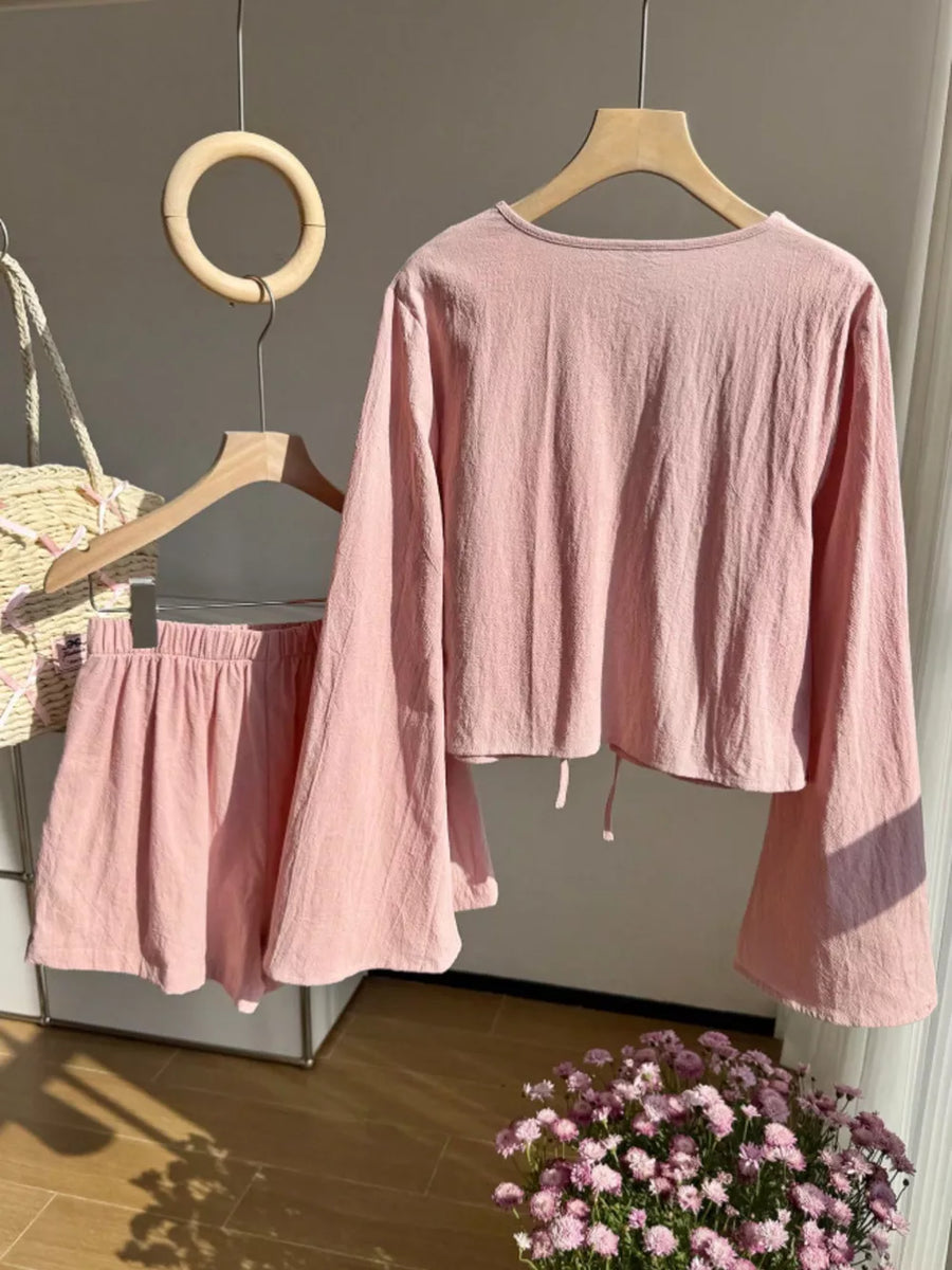 Pink tie-front top with bell sleeves and matching elastic waist shorts set