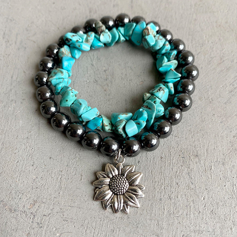 Hematite and turquoise stacked bracelet with sunflower charm