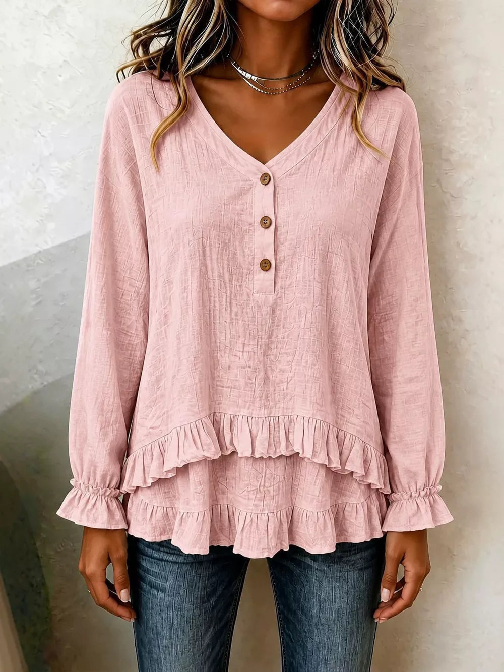 blouse in blush pink featuring buttoned and relaxed fit
