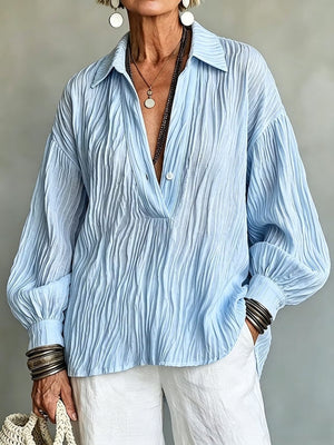 blouse featuring textured in Sky Blue with 100% polyester Care instructions: Machine wash cold texture