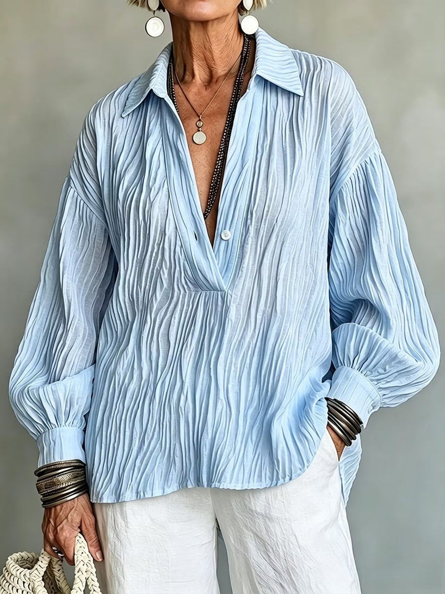 blouse featuring textured in Sky Blue with 100% polyester Care instructions: Machine wash cold texture