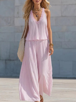 Pink striped two-piece set with ruffle trim, wide leg pants and pleated tank top.