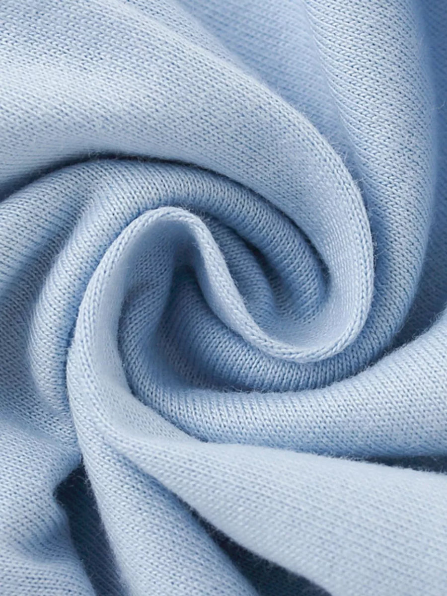 Light blue knit fabric with a soft texture and subtle ribbing.