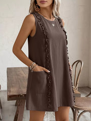 Coffee brown sleeveless dress with frill detail and pockets.