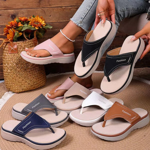 Platform toe post sandals in pink, black, gray, blue, white, and tan with contrast stitching.