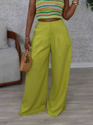 Sophisticated high-waist flowing trousers in lime green with pleats and wide legs.