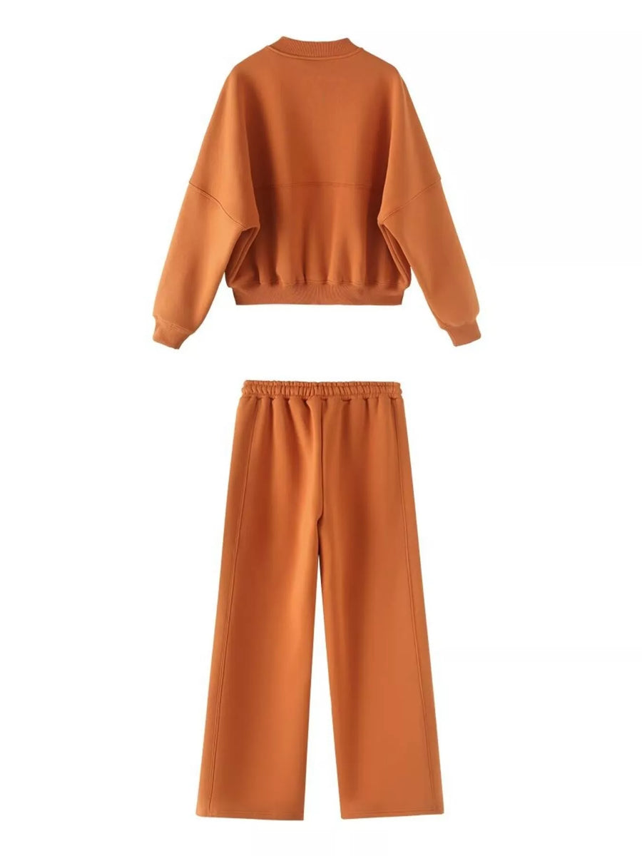 Orange casual zip-up top and wide-leg pants set