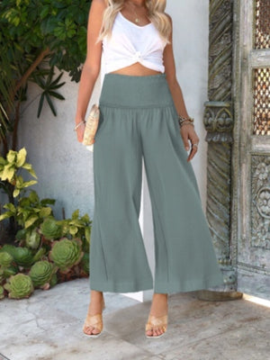 Smocked waist wide-leg trousers in light green, ankle length, casual style.