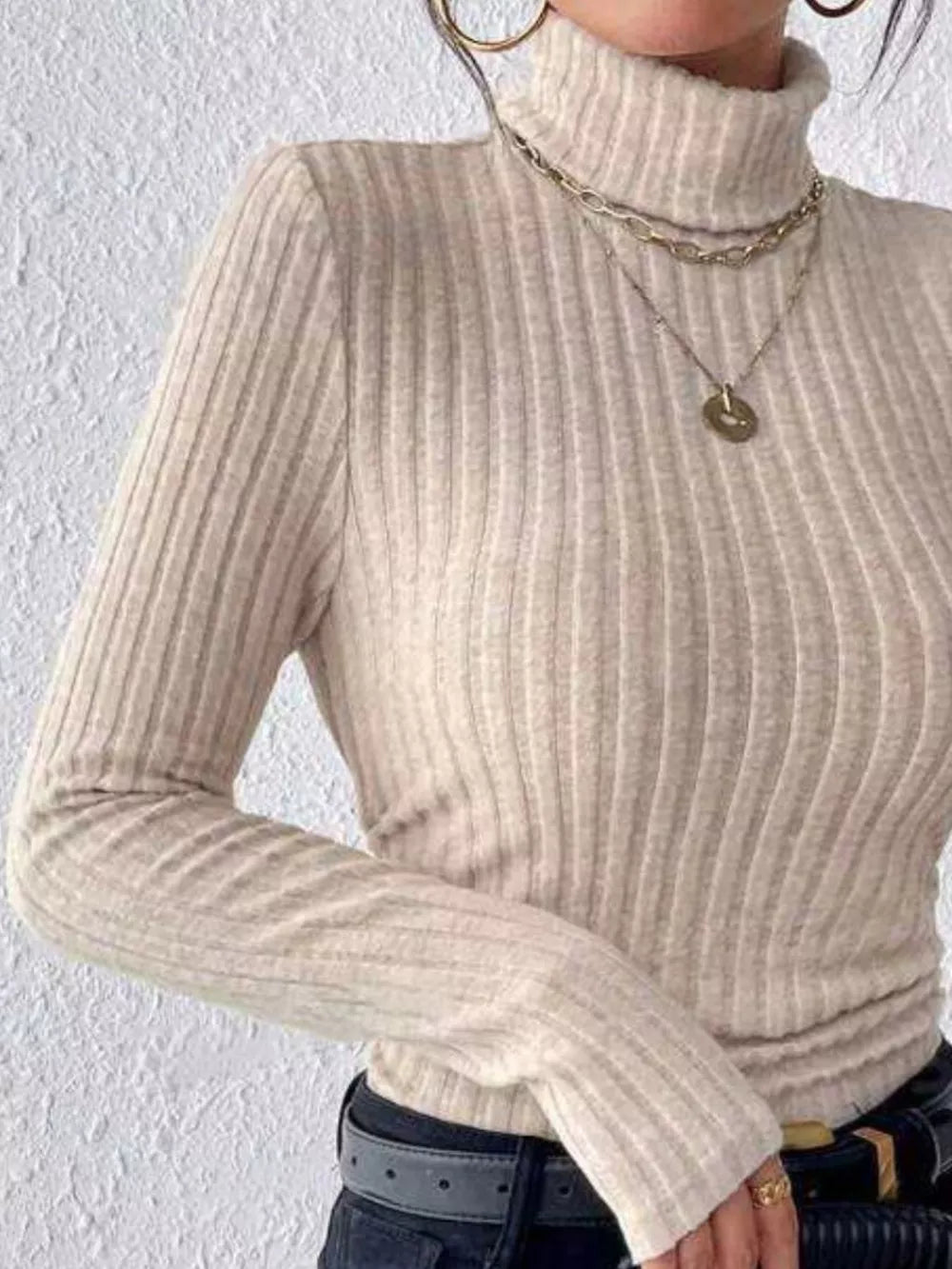 Khaki ribbed turtleneck long sleeve tee with a high neckline and fitted silhouette.