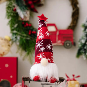 Red knit gnome with snowflake pattern and white beard, topped with a red star.