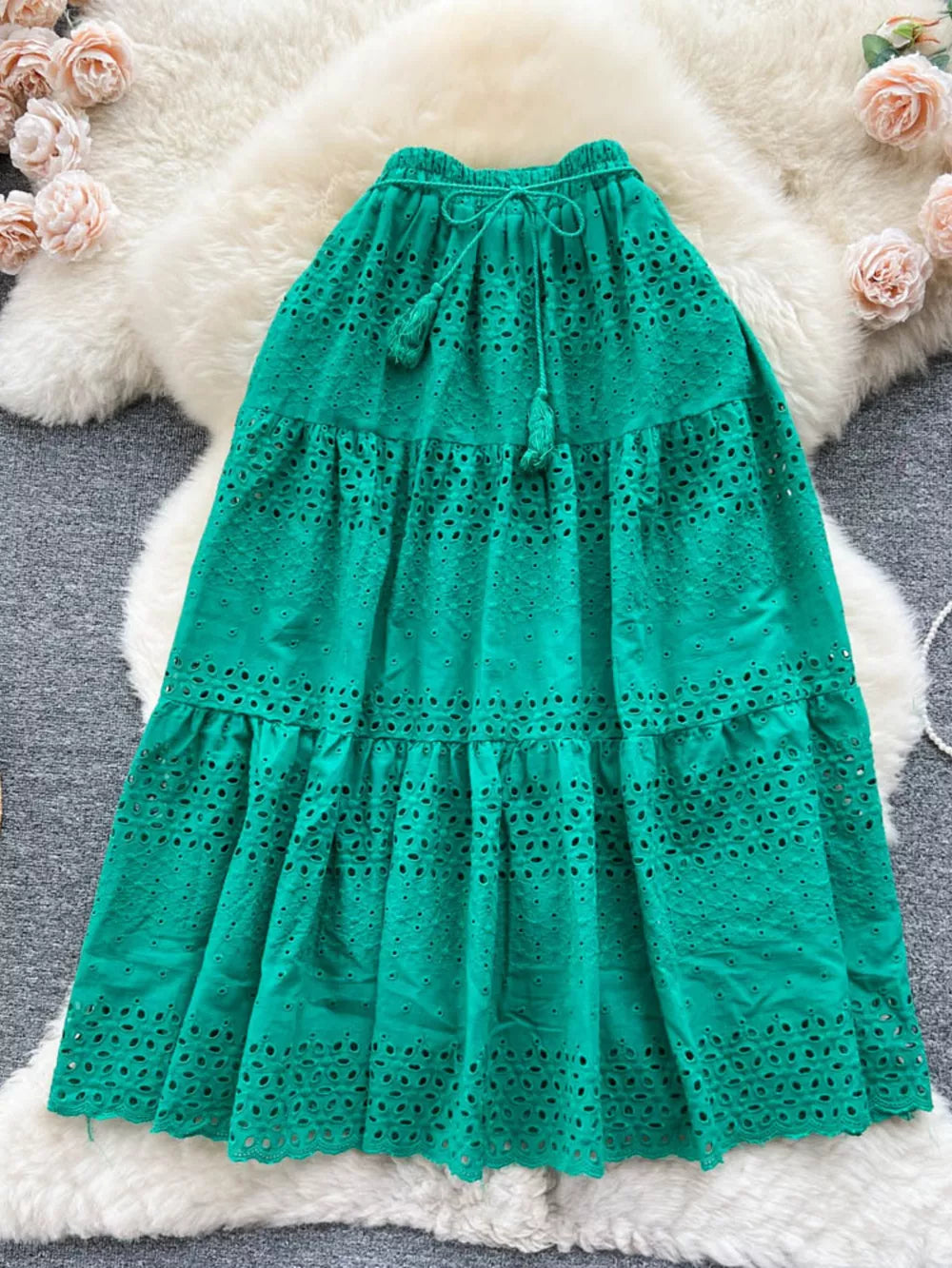Green eyelet tiered maxi skirt with tassel drawstring waist