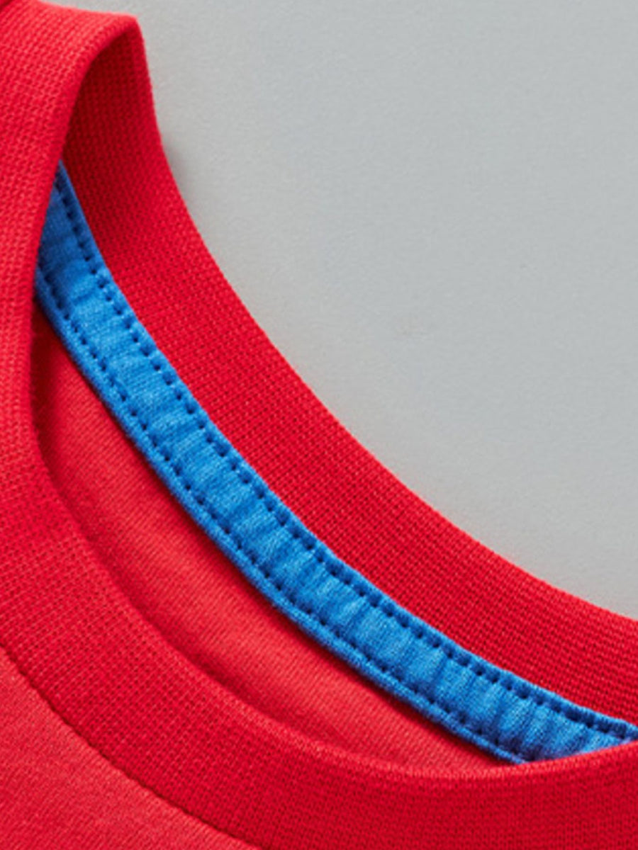 Red cotton toddler t-shirt with blue contrast stitching on the neckline.