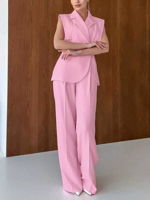 two-piece set in light pink featuring buttoned and fitted top, wide-leg bottom fit