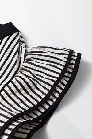 Chic black and white striped cotton midi dress detail with ruffled sleeves and black trim.
