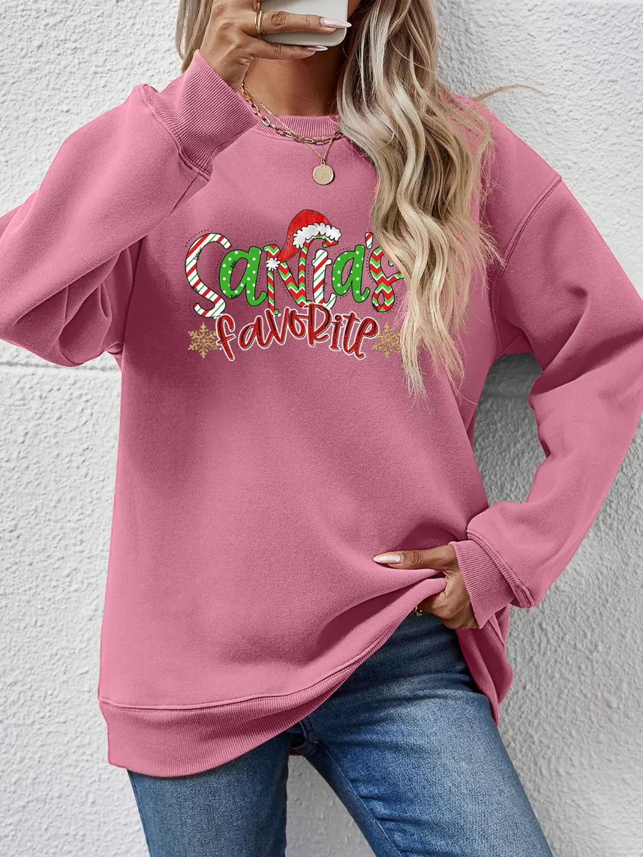 Blush Pink crewneck sweatshirt with Santa's Favorite graphic and candy cane stripes.