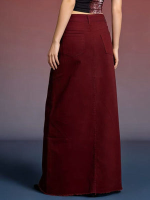 Burgundy raw hem maxi denim skirt with button closure and back pockets.