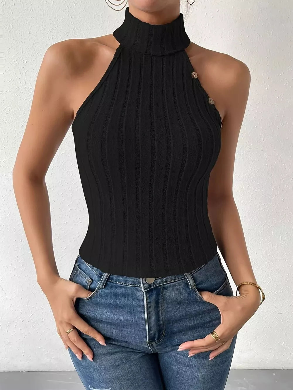 Black ribbed turtleneck tank top with decorative buttons and halter neckline