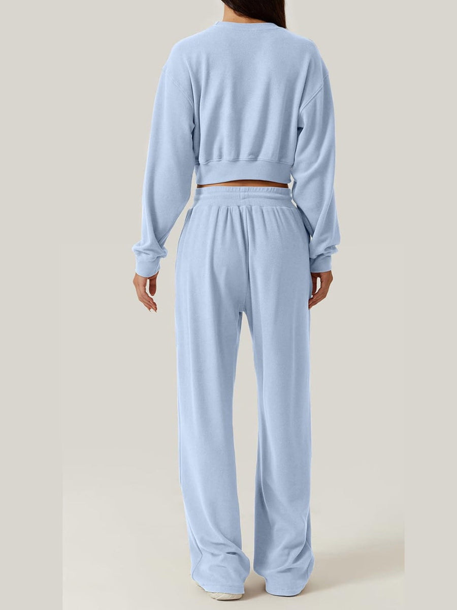 Light blue knit lounge set with cropped sweatshirt and wide-leg pants